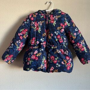 Little Me floral puffer jacket with a fleece lining and a bow detail  waist.
